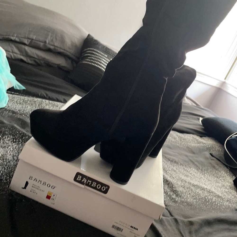 Black flat over the knee boots from Fashion Nova